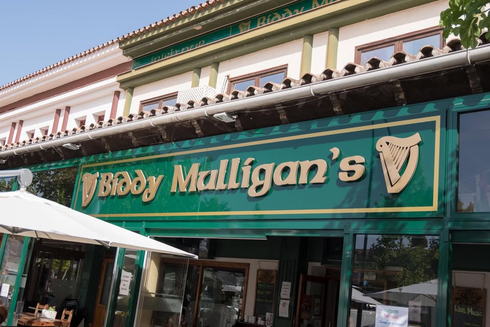 The green and gold exterior of Biddy Mulligan's La Cala